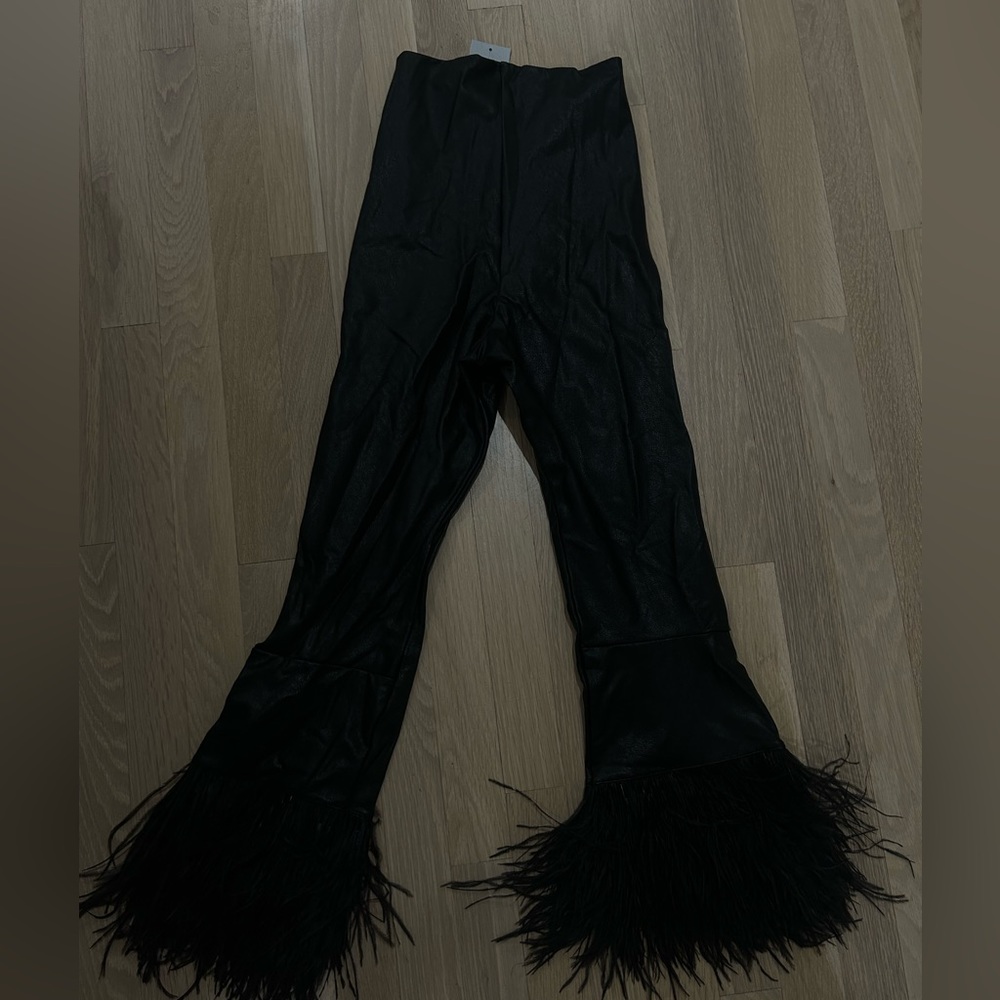 Faux leather faux feather leggings from the brand Commando purchased at Saks